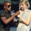 Man interrupts woman receiving an award on stage.