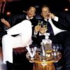 Two men celebrating in a limousine.
