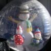 Snowmen inside a large inflatable snow globe.