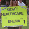 Protester holding sign against government healthcare.