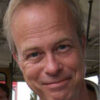 Smiling man in a casual setting.