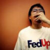 Person yawning, wearing "FedUp" T-shirt.