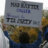 Person holding a humorous protest sign.
