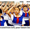 Students in uniform raising their hands.