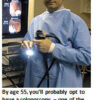 Doctor holding colonoscopy equipment in medical setting.