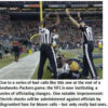 Referees signal touchdown in football game.