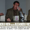 Man gesturing and speaking at a conference.