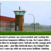 Prison with guard tower and fence.