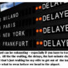 Flight information board showing delays.