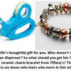 Scissors with tape dispenser and charm bracelet.