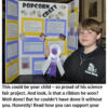 Boy holding ribbon in front of project.