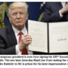 Person holding signed executive order document.