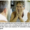 Man looking in bathroom mirror, appearing contemplative.