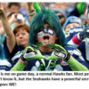 Excited fan in Seahawks-themed face paint.