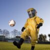 The Coronavirus doesn’t mean an end to sports. It just means taking a few common-sense precautions for your safety. Take this striker for Arsenal Soccer. He can continue to play with no worries – just so long as his helmet doesn’t fog up.