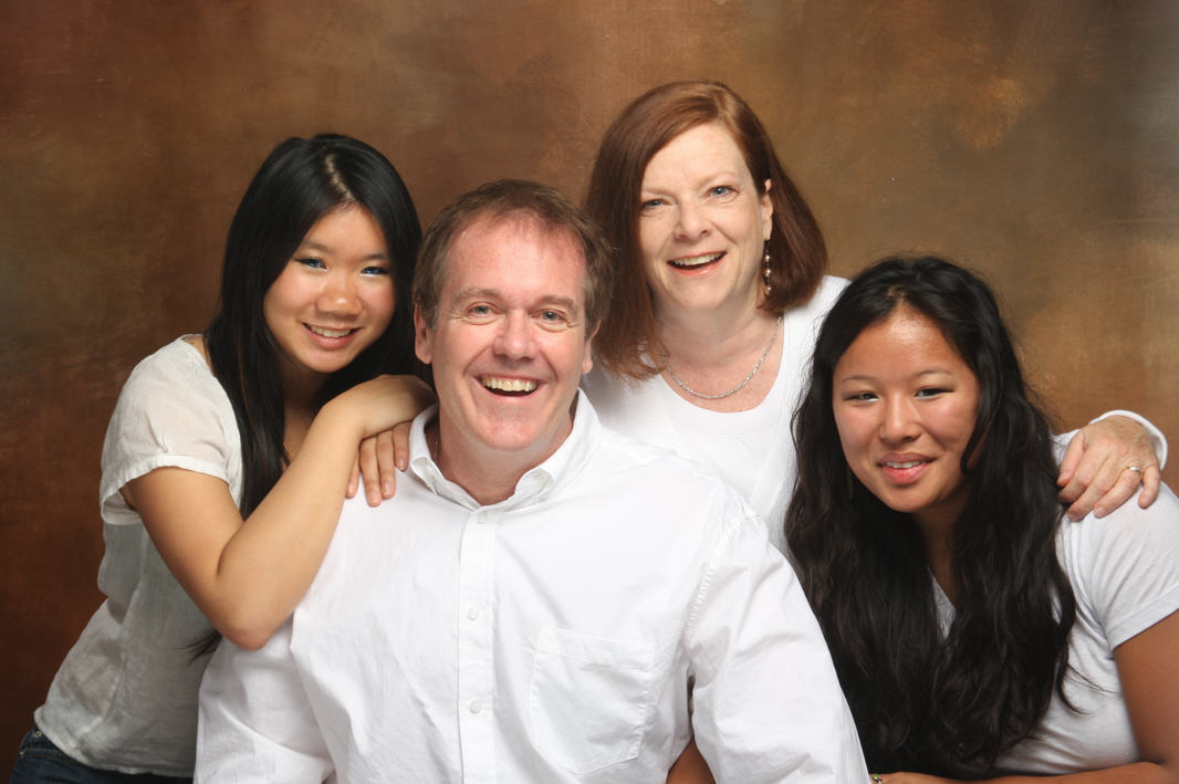 This is a photo of my family. Turns out that like our two daughters, who we adopted from China as infants, there is one more person in this picture from China. Read about my fascinating, life-changing heritage discovery.