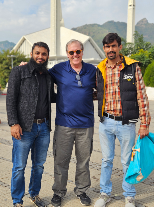 I explained to H and H that in America, when we pose for photos, we put our arms around each other and smile. I said, “This is an American pose.” After a couple days, when someone took our photo, Hafiz would remind Hammad, “Let’s do an American pose.”