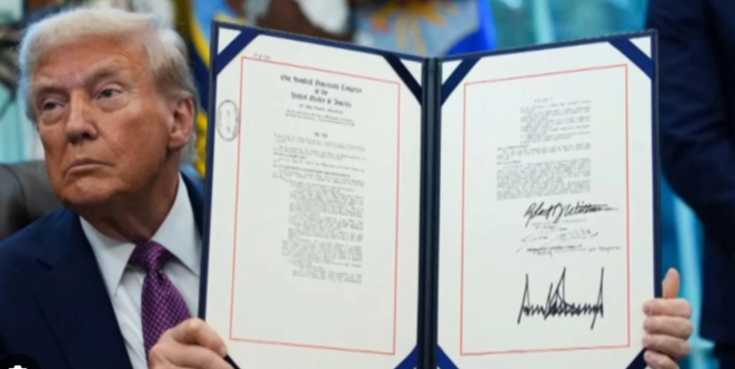 Trump continues to sign executive orders at a frenetic pace. In this image, he displays a recent EO in which he proclaimed that the 4th of July holiday will henceforth be renamed “Trump Saved America Day.”